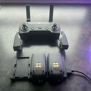 DJI Model: GL100A remote. Two DJI Spark batteries with charging docking station.